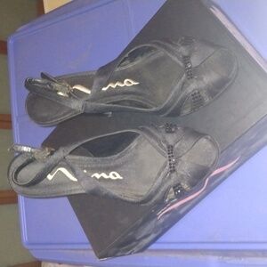 Mia Staten and black rhinestone heels